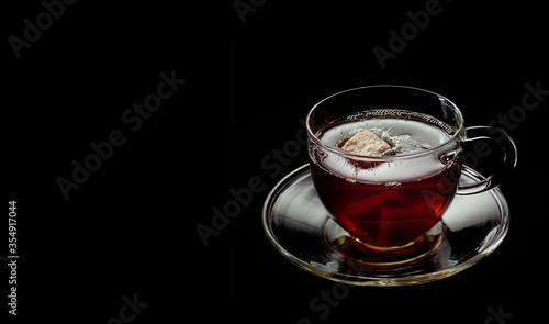 cip of tea on the black background