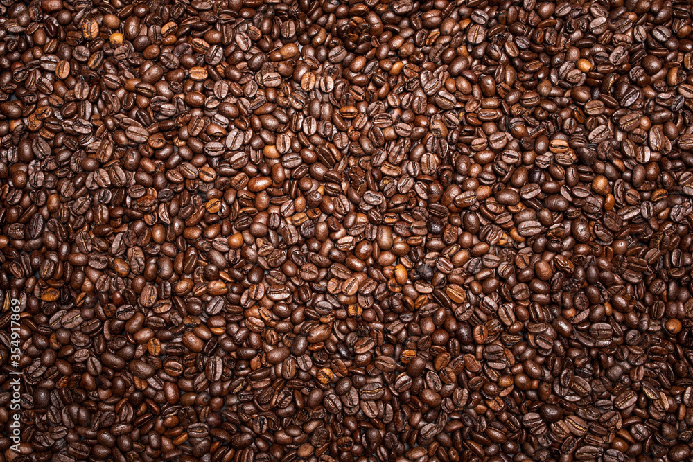 Obraz premium Coffee beans background view from above.