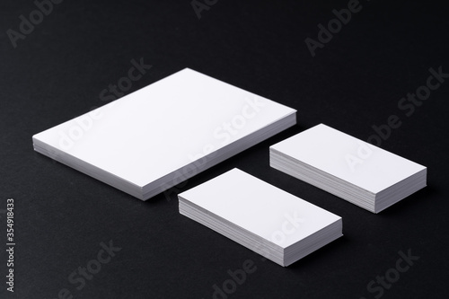 White blank business cards on dark black background