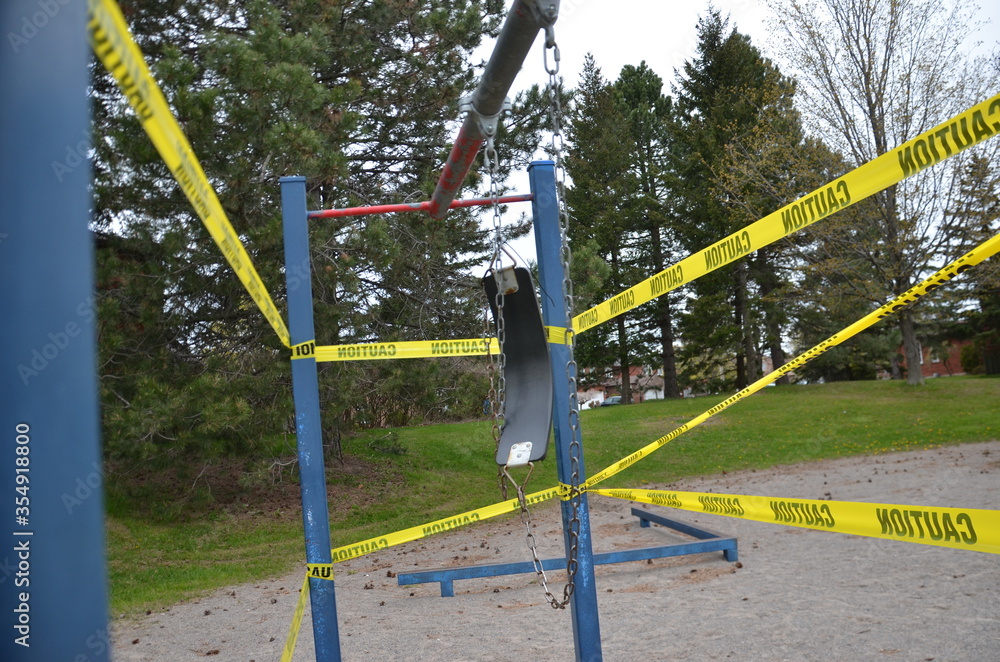 Fototapeta premium A COVID-19 closed playground and equipment in Scarborough, Ontario. This closure is part of the City of Toronto’s ongoing efforts to stop the spread of COVI