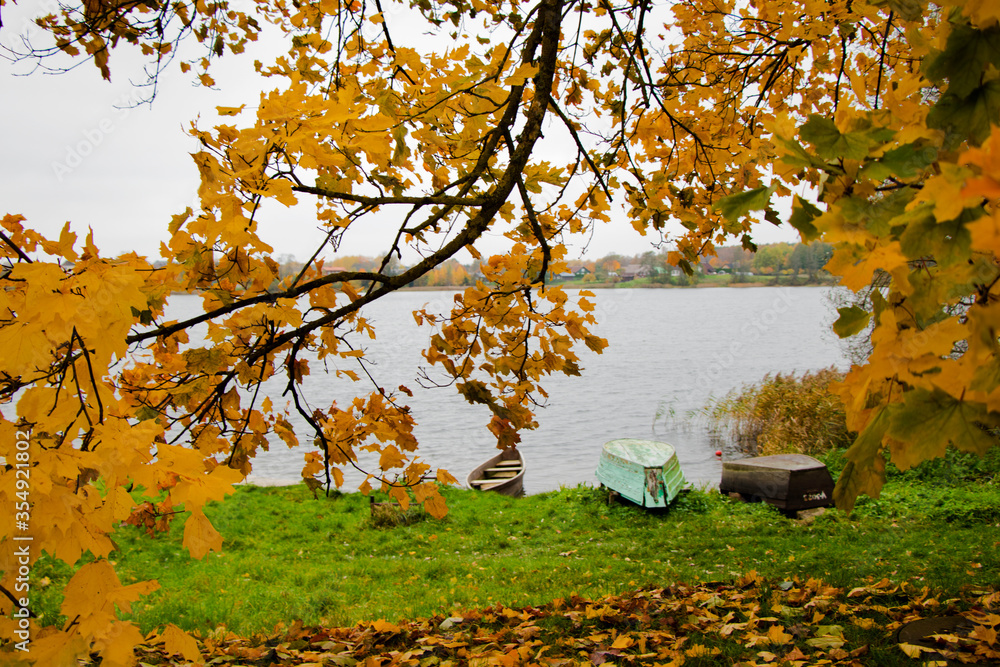 Old wooden boats near the beach of Trakai Gavle lake lake, Lithuania Old wooden boats near the beach of Trakai Gavle lake lake, Lithuania