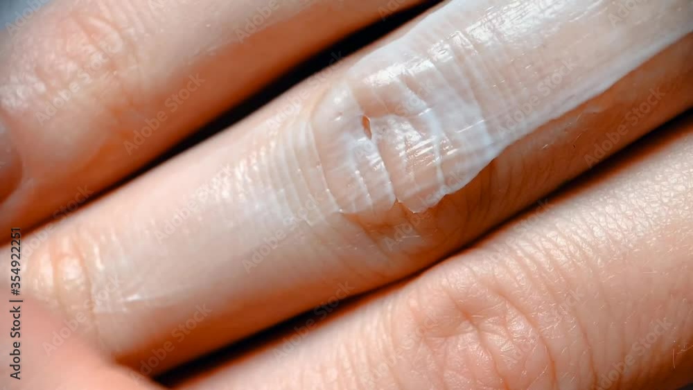 Close-up video of a girl applying a creamy cosmetic product to her hand. Cosmetic creams and lotions, spa treatments and body care. Close-up video of a girl applying a creamy cosmetic product to her hand. Cosmetic creams and lotions, spa treatments and body care.