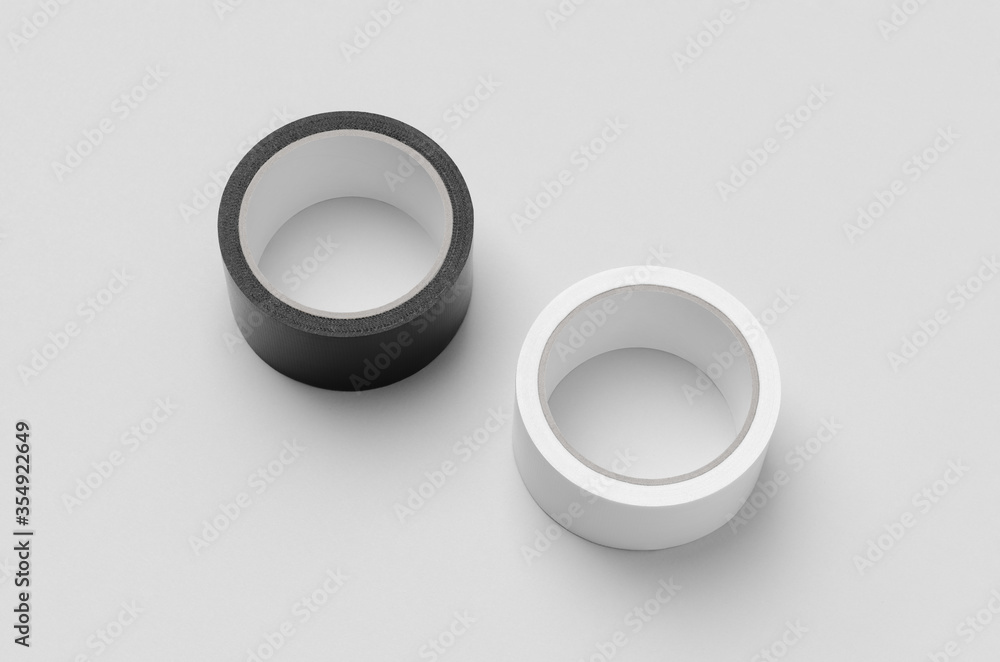 Black and white duct tapes mockup on a grey background. Black and white duct tapes mockup on a grey background.