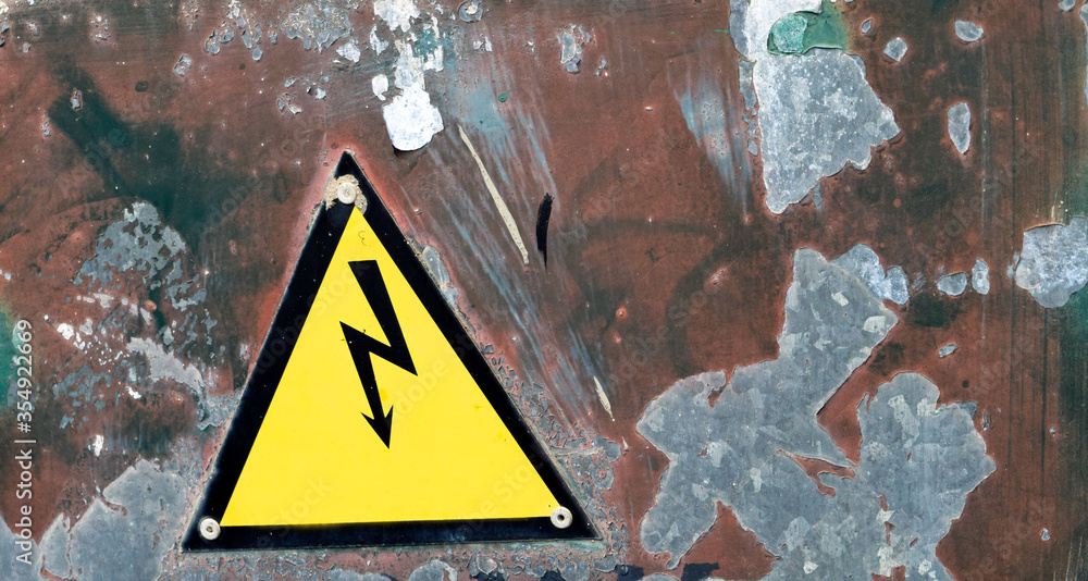 Electricity sign on worn background 
