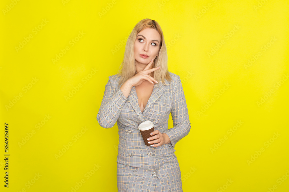 Business blonde woman with cup of coffee