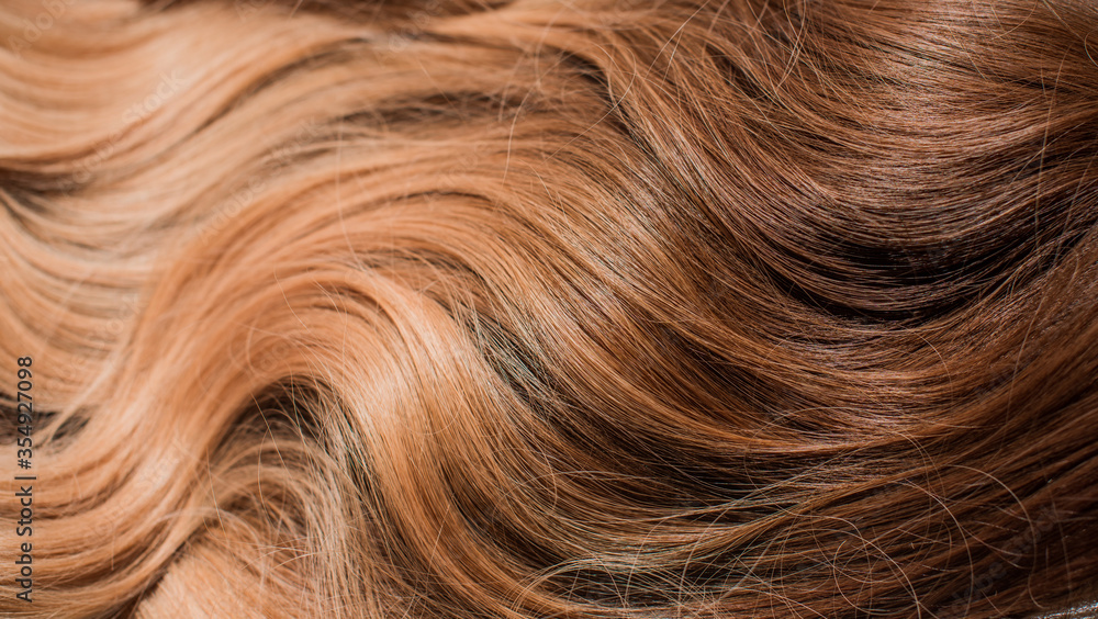 Wigs synthetic and natural hair. Light blown and blonde ombre hair. Womens beauty concept Wigs synthetic and natural hair. Light blown and blonde ombre hair. Womens beauty concept