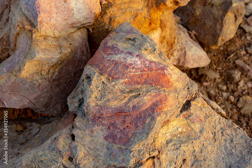 close up of a stone with colorful striations 