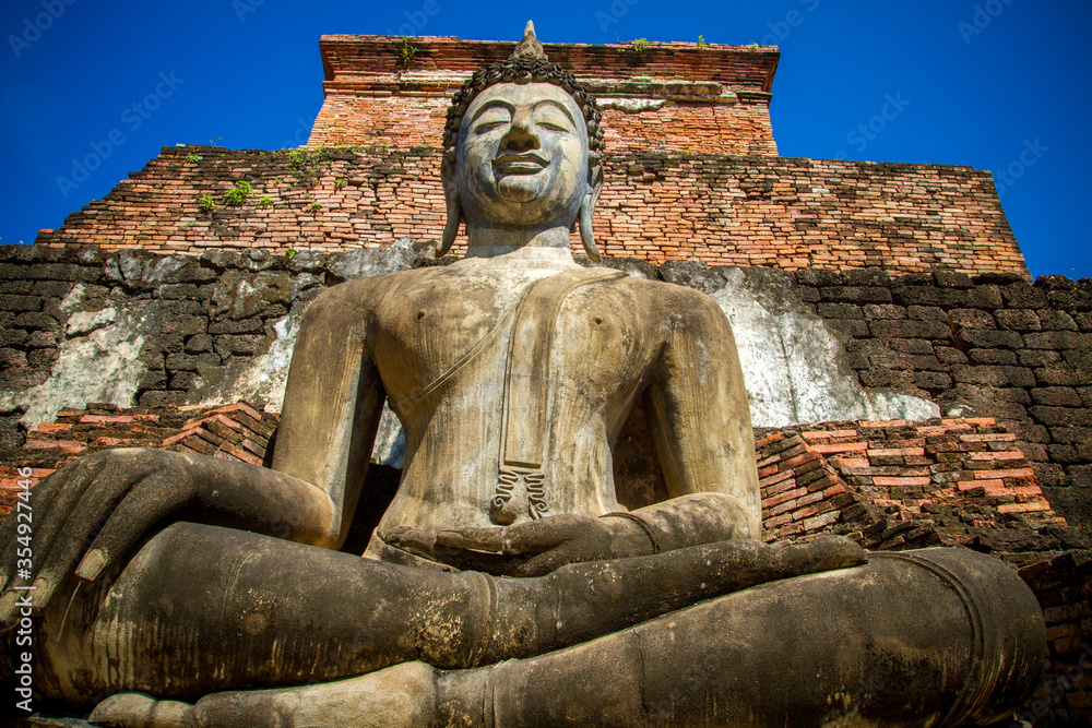 Fototapeta premium Wat Mahathat, Sukhothai old city, Thailand. Ancient city and culture of south Asia.