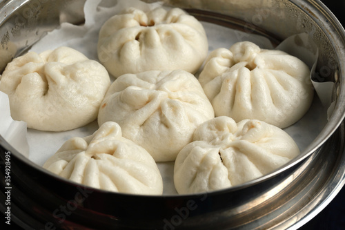 Steamed BBQ pork bun, also know as Baozo, is a type of filled bun or bread-like dumpling in various Chinese cuisines.