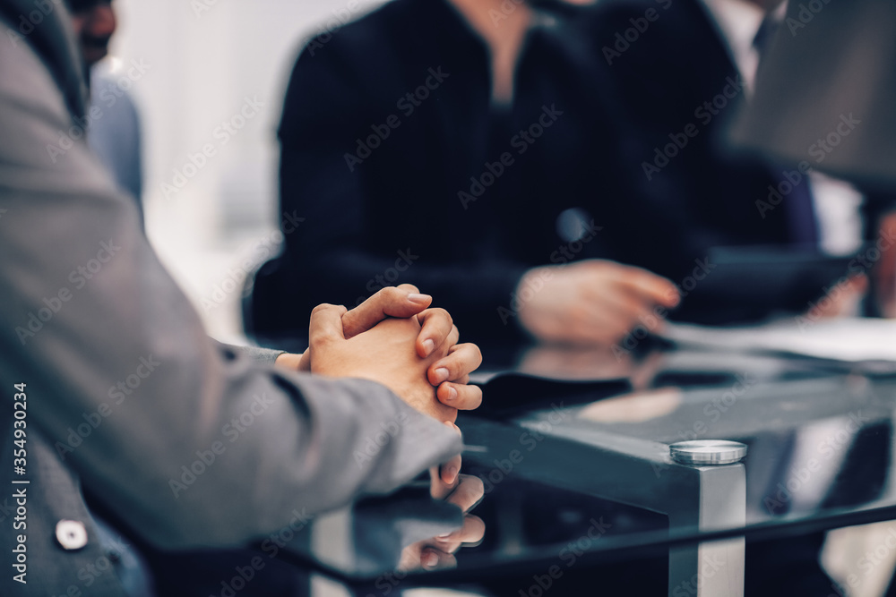 close up. background image of a businessman sitting at a meeting table.