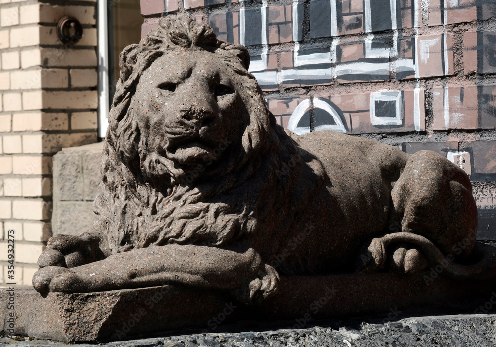 Lion statue. Stone monument. Medieval architecture. Historical heritage.