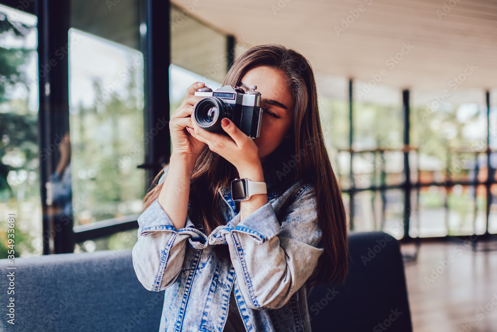 Young woman focusing to taking pictures enjoying free time