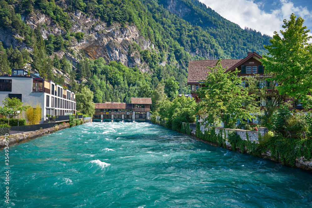 Naklejka premium Panorama of Interlaken with river and wooden bridge, Switzerland