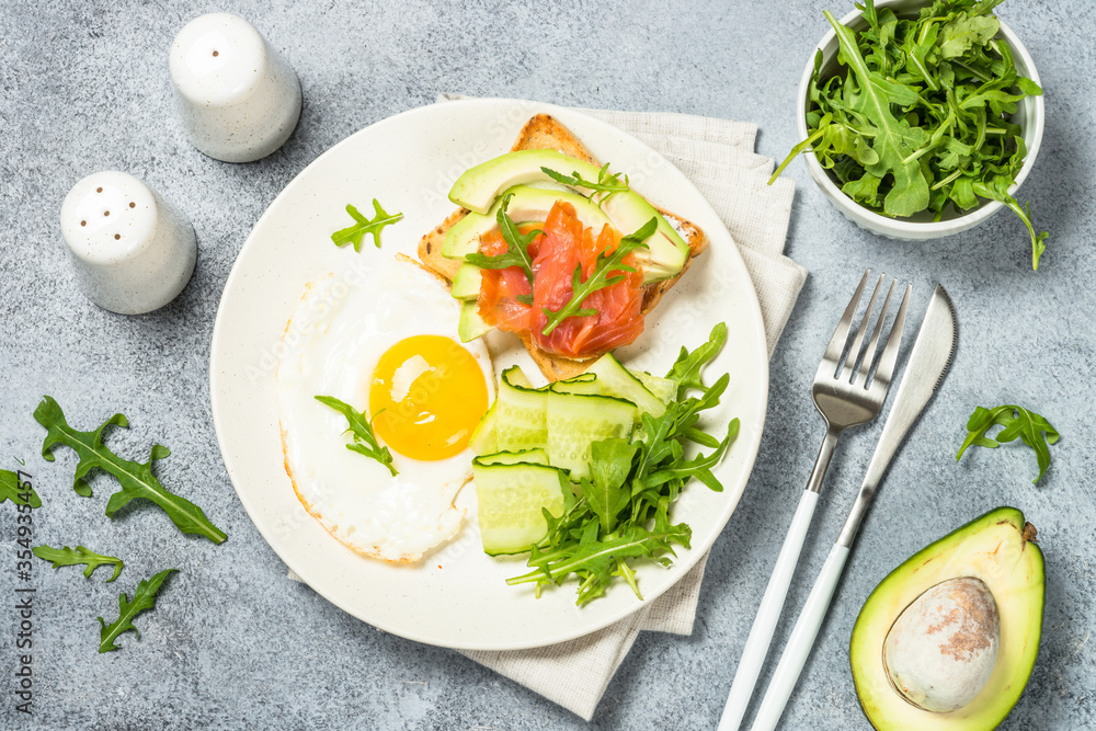 Healthy breakfast with egg, toast and salad.