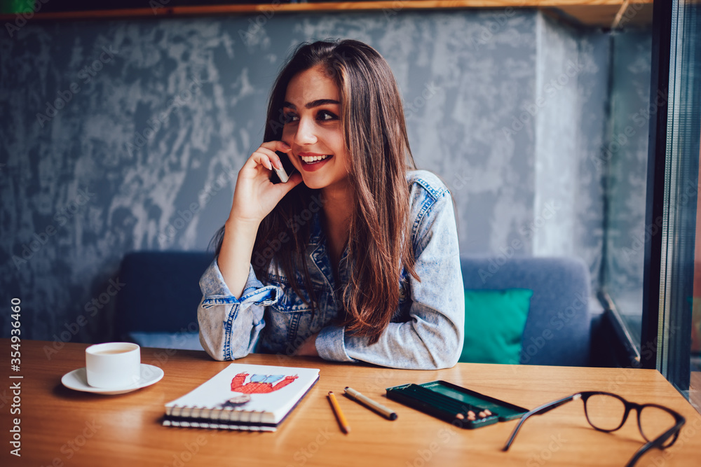 Half length portrait of positive hipster girl in optical eyeglasses smiling at camera Half length portrait of positive hipster girl in optical eyeglasses smiling at camera