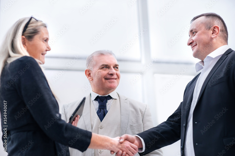 close up. smiling business people shaking hands. close up. smiling business people shaking hands.