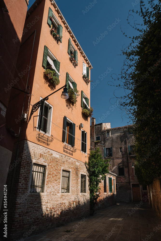 Narrow and bright streets of sunny Venice, Italy.