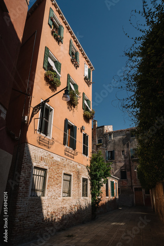Narrow and bright streets of sunny Venice, Italy.