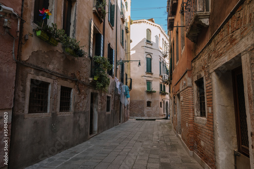 Deserted street of Venice and only linen is dried on a rope, Italy.
