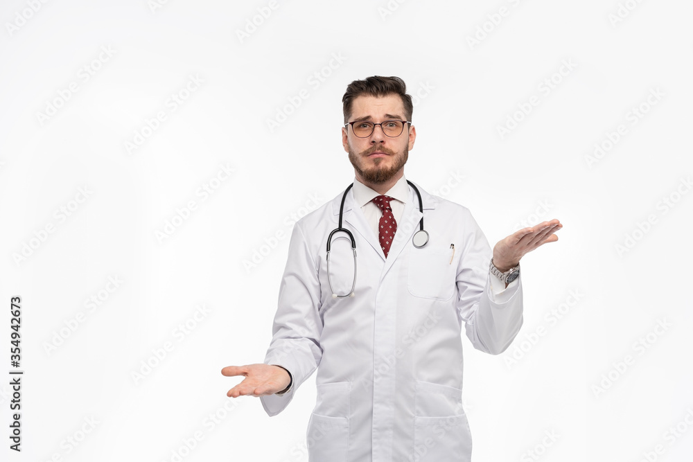 A portrait of a medical doctor posing against white background A portrait of a medical doctor posing against white background
