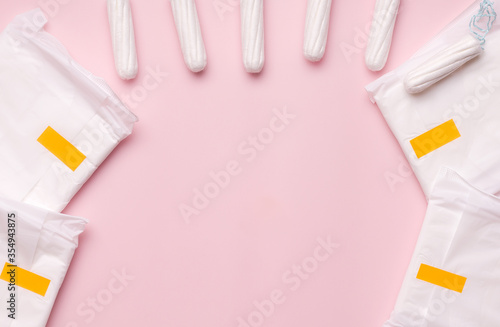The concept of protection during the menstrual cycle. Gaskets and tampons on the table. Copy space