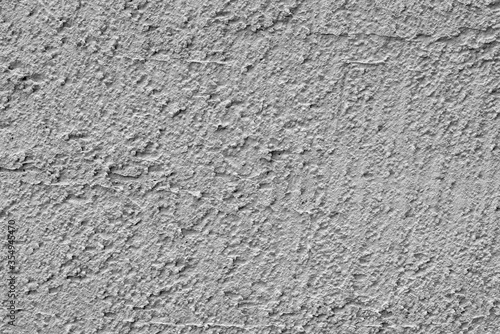 Gray rough plaster. Texture of wall of house. Abstract gray background.