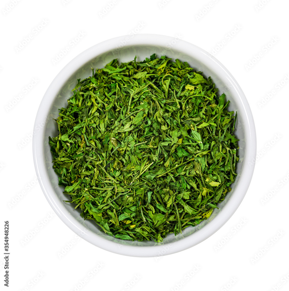 Dried Parsley Flakes Seasoning Spice Isolated on White Background. Dried Parsley Flakes Seasoning Spice Isolated on White Background.