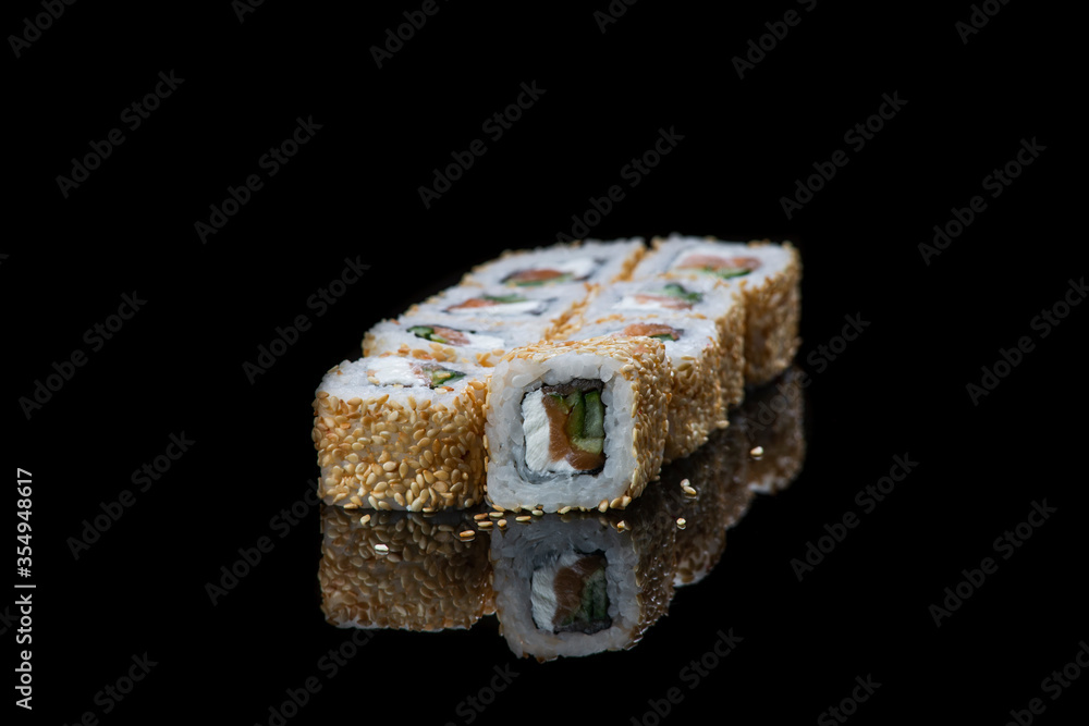 Sushi Roll On A Black Background reflection . Japanese food. Close Up. Sushi Roll On A Black Background reflection . Japanese food. Close Up.