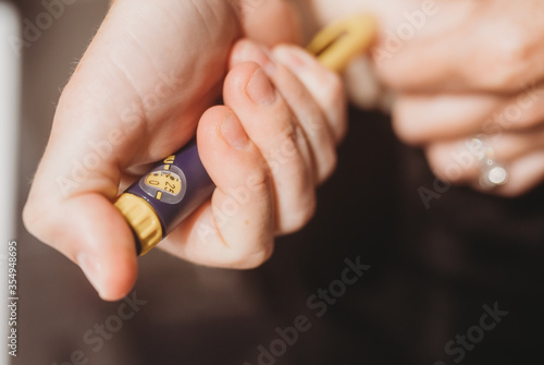Woman injecting fertility treatment into stomach 