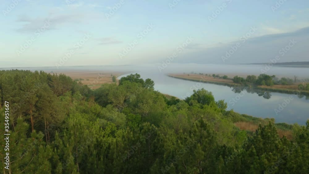 Beautiful view of river and forest in morning, slow motion effect. Drone video recording Beautiful view of river and forest in morning, slow motion effect. Drone video recording