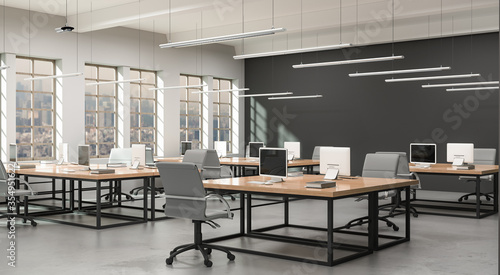 Side view of a modern office with a grey wall. Rows of tables, equipped workstations. 3d rendering.