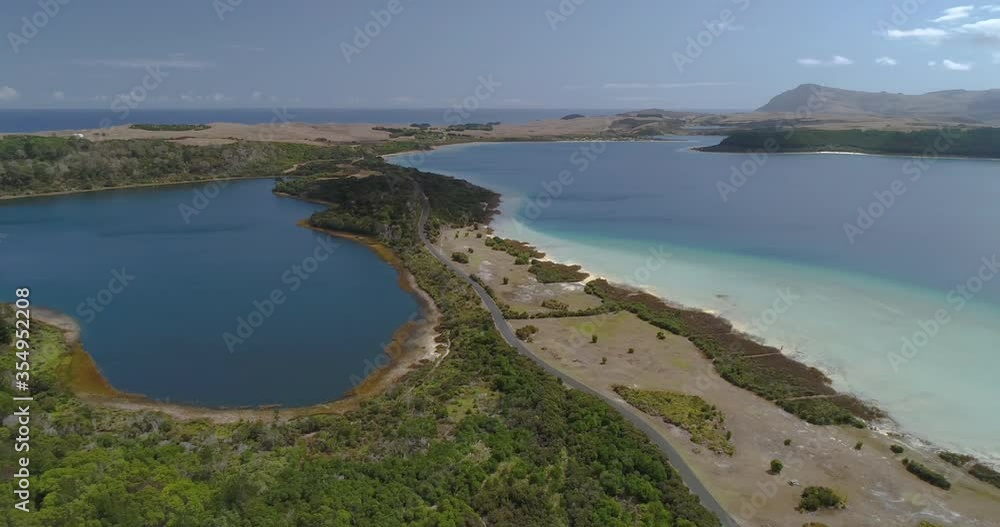 4k aerial left to right panning motion of the Kai Iwi lakes, a hidden fresh water lakes system near ninety mile beach,popular for camping and swimming,north island,New Zealand 4k aerial left to right panning motion of the Kai Iwi lakes, a hidden fresh water lakes system near ninety mile beach,popular for camping and swimming,north island,New Zealand