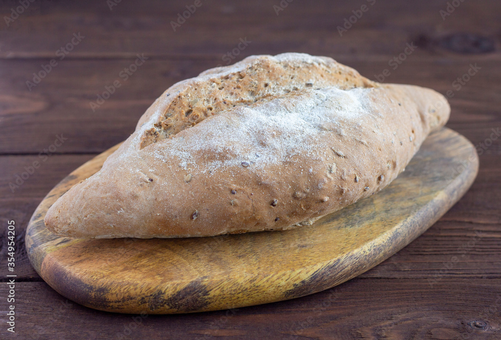 Homemade grain healthy bread.Bread made from gray flour with the addition of cereals.Healthy food. Homemade grain healthy bread.Bread made from gray flour with the addition of cereals.Healthy food.