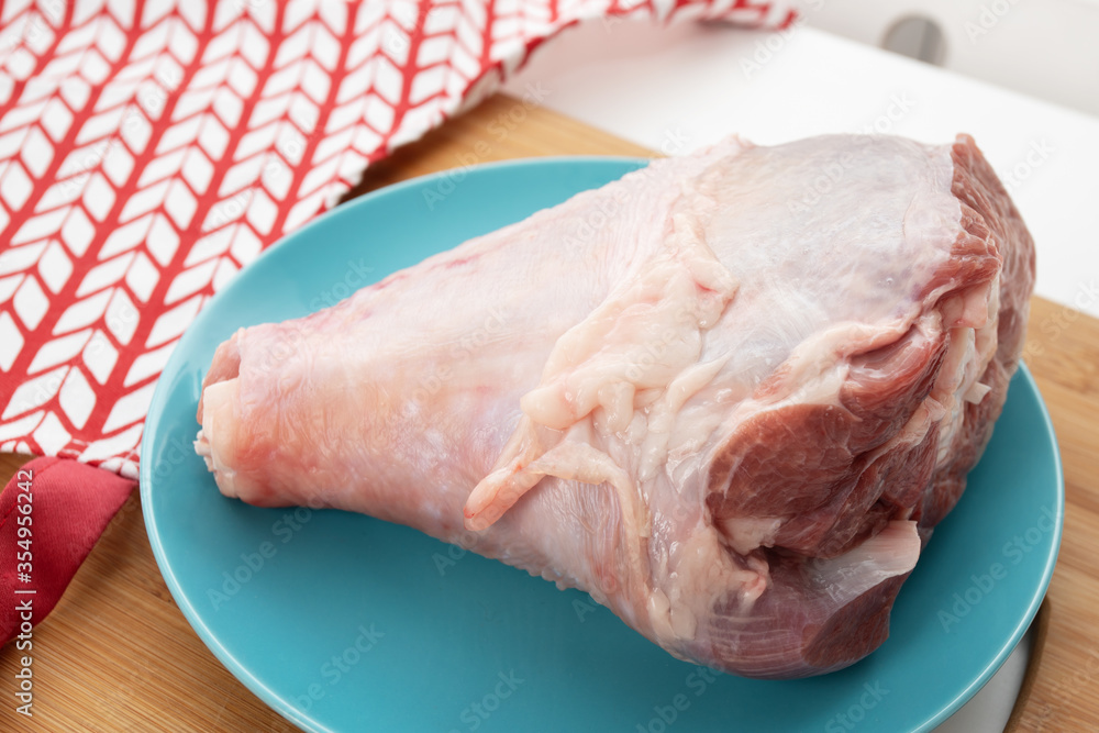 Cooking a delicious dinner. Turkey leg on the table before baking Cooking a delicious dinner. Turkey leg on the table before baking