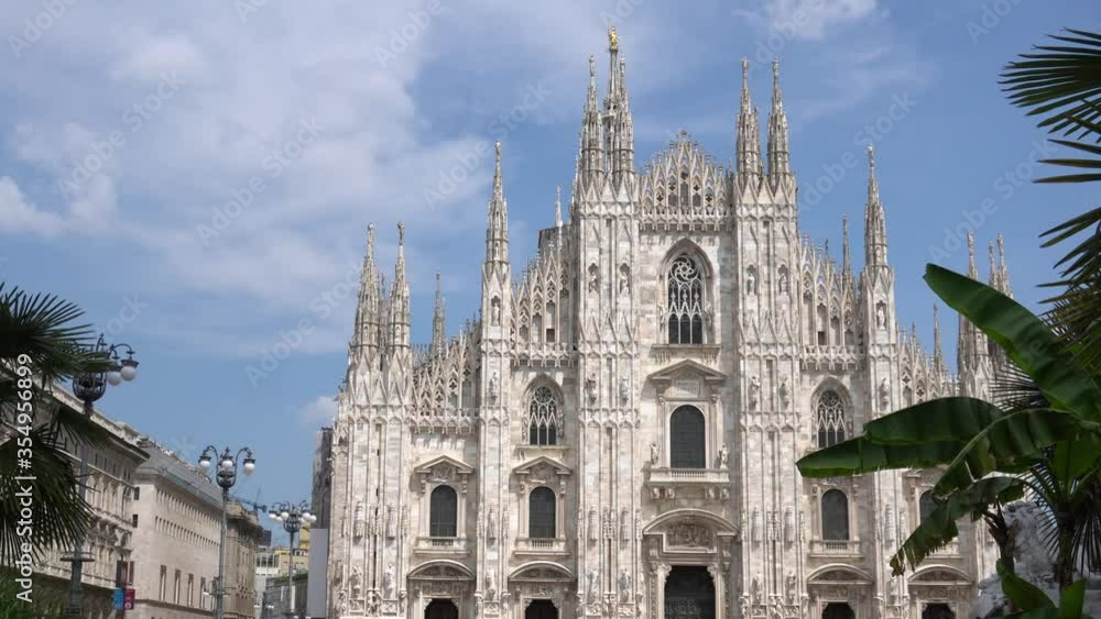 ITALY, MILAN, June 2020: End of quarantine lockdown covid19 Coronavirus, People with masks walking i Duomo Cathedral Square - downtown empty of tourists ITALY, MILAN, June 2020: End of quarantine lockdown covid19 Coronavirus, People with masks walking i Duomo Cathedral Square - downtown empty of tourists