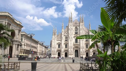 ITALY, MILAN, June 2020: End of quarantine lockdown covid19 Coronavirus, People with masks walking i  Duomo Cathedral Square - downtown empty of tourists   