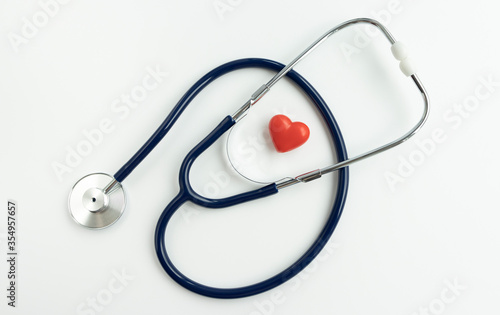 Stethoscope and heart on white background, Close up.
