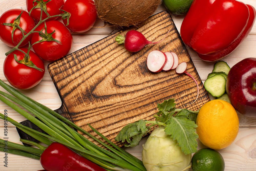 Preparing food at home. Close up of wooden rustic cutting chief board with vegetables top view, copy space. Menu concept. Preparing food at home. Close up of wooden rustic cutting chief board with vegetables top view, copy space. Menu concept.