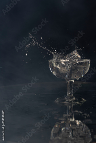 A splash with water and ice on a black background