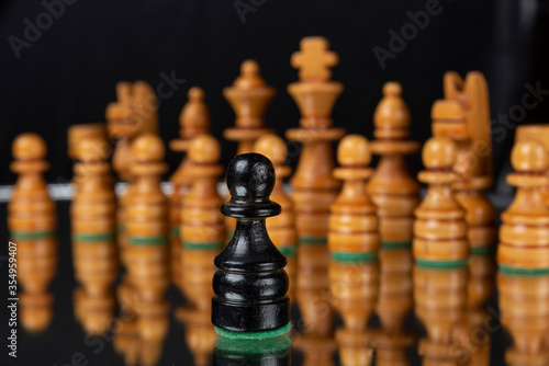 chess pieces mounted on a black surface