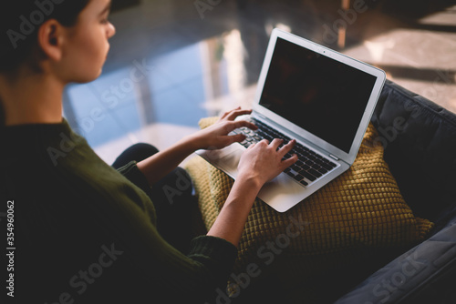 Person searching information in internet via computer. Copy space area for advertising