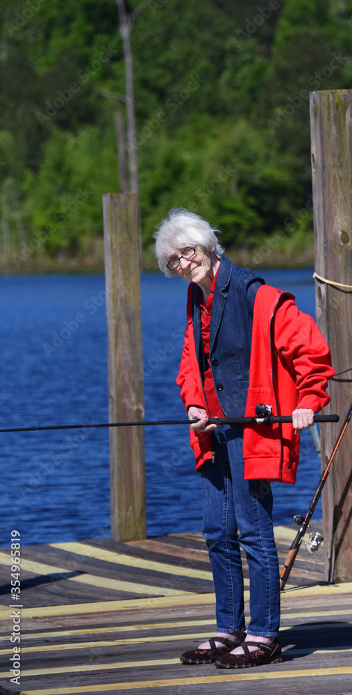 Elderly woman fishes for the first time