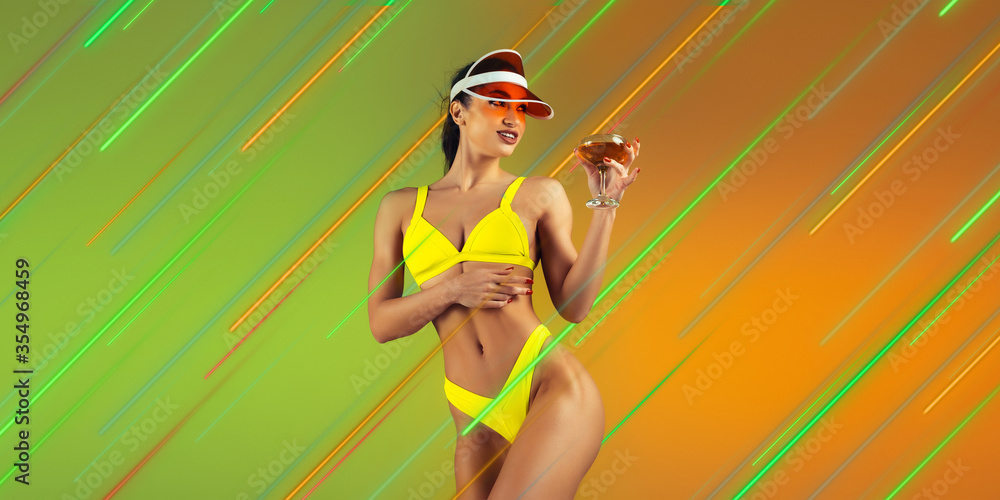Beautiful woman in swimsuit with cocktail. Creative portrait with copyspace. Neon colored portrait with neon lines, flyer, proposal. Motion, youth culture concept. Contemporary art, modern design.