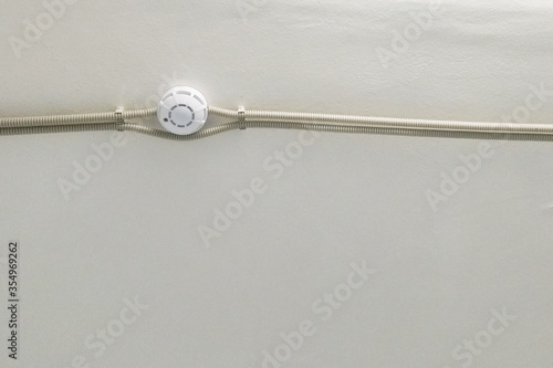 fire alarm security safety device system, attached to ceiling in home, office or public area, alert safety of public incase of fire, red sound system sensor will detect fire smoke and warn employee © Павел Чепелев