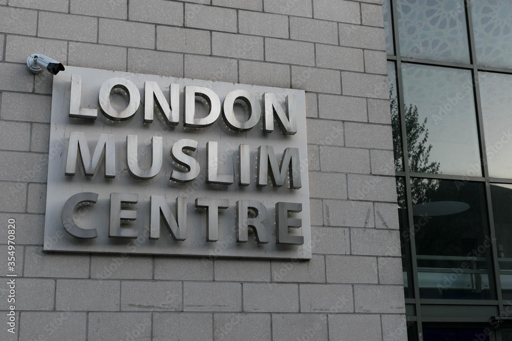 Obraz premium Close up of London Muslim Centre entrance with Islamic Andalusian tiled art. Largest Islamic centre Mosque in UK. Muslims worshippers gather for prayer & services