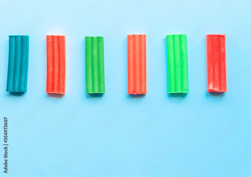 cute flower made of multi-colored plasticine clay on a pink background, multi-colored dough, minimal, children's crafts cute flower made of multi-colored plasticine clay on a pink background, multi-colored dough, minimal, children's crafts
