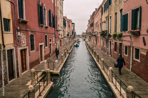 Venetian canal between the old facades of houses. © Наталья Иванова