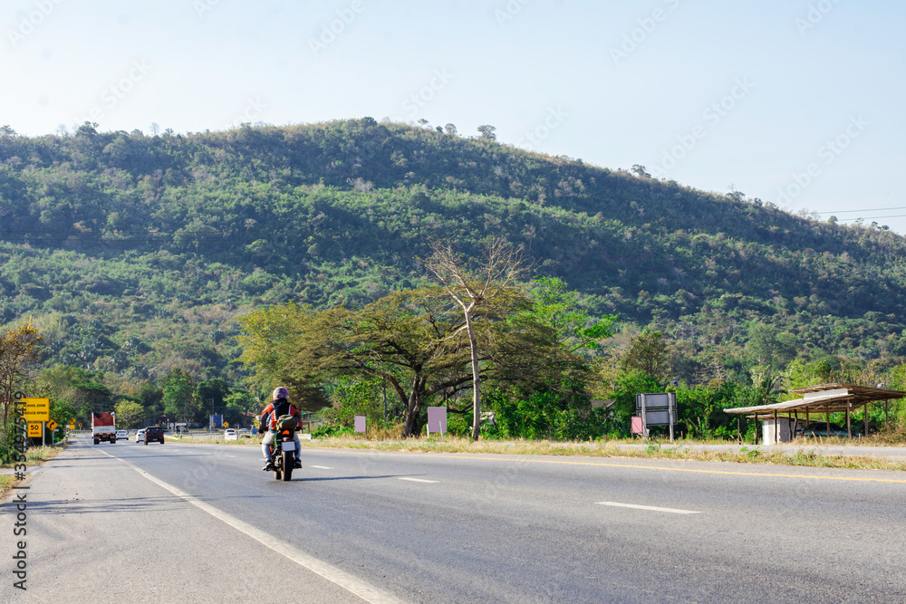 Obraz premium Beautiful green road in countryside, Landscape road with green forest, Main road on the mountain