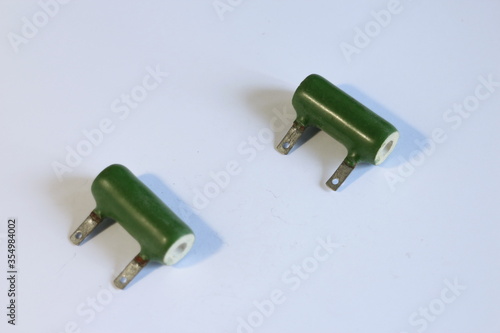 old electronic parts, capacitors on a white background photo