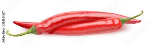 Two red hot peppers isolated on white background